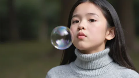 The girl is blowing bubbles